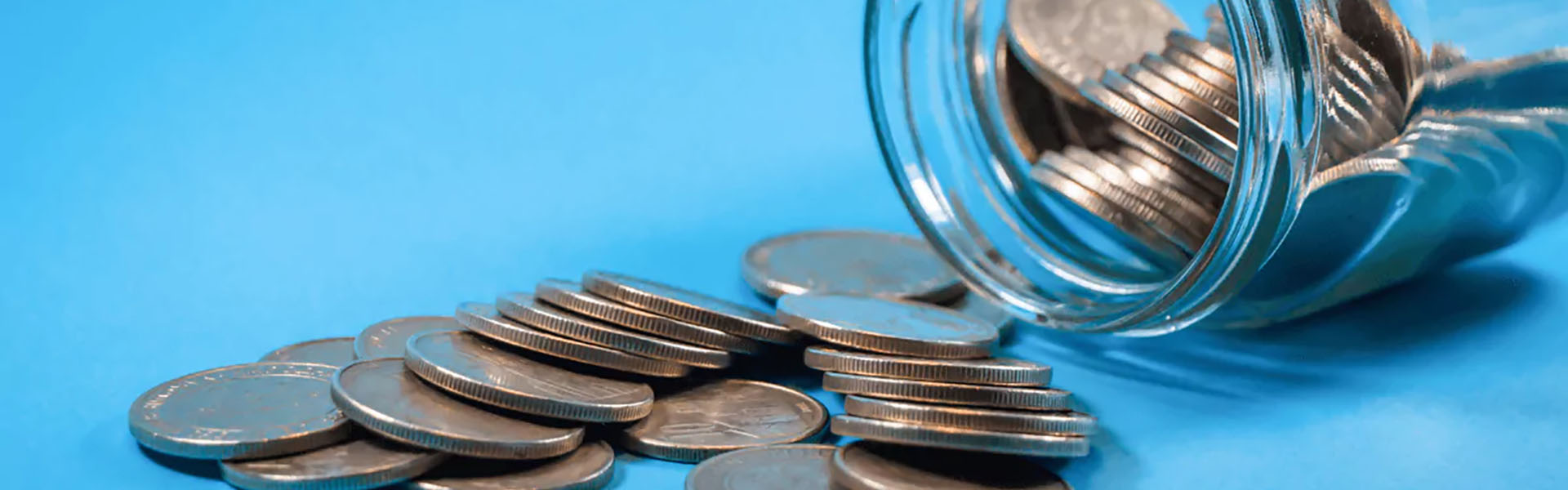 Coins falling from jar